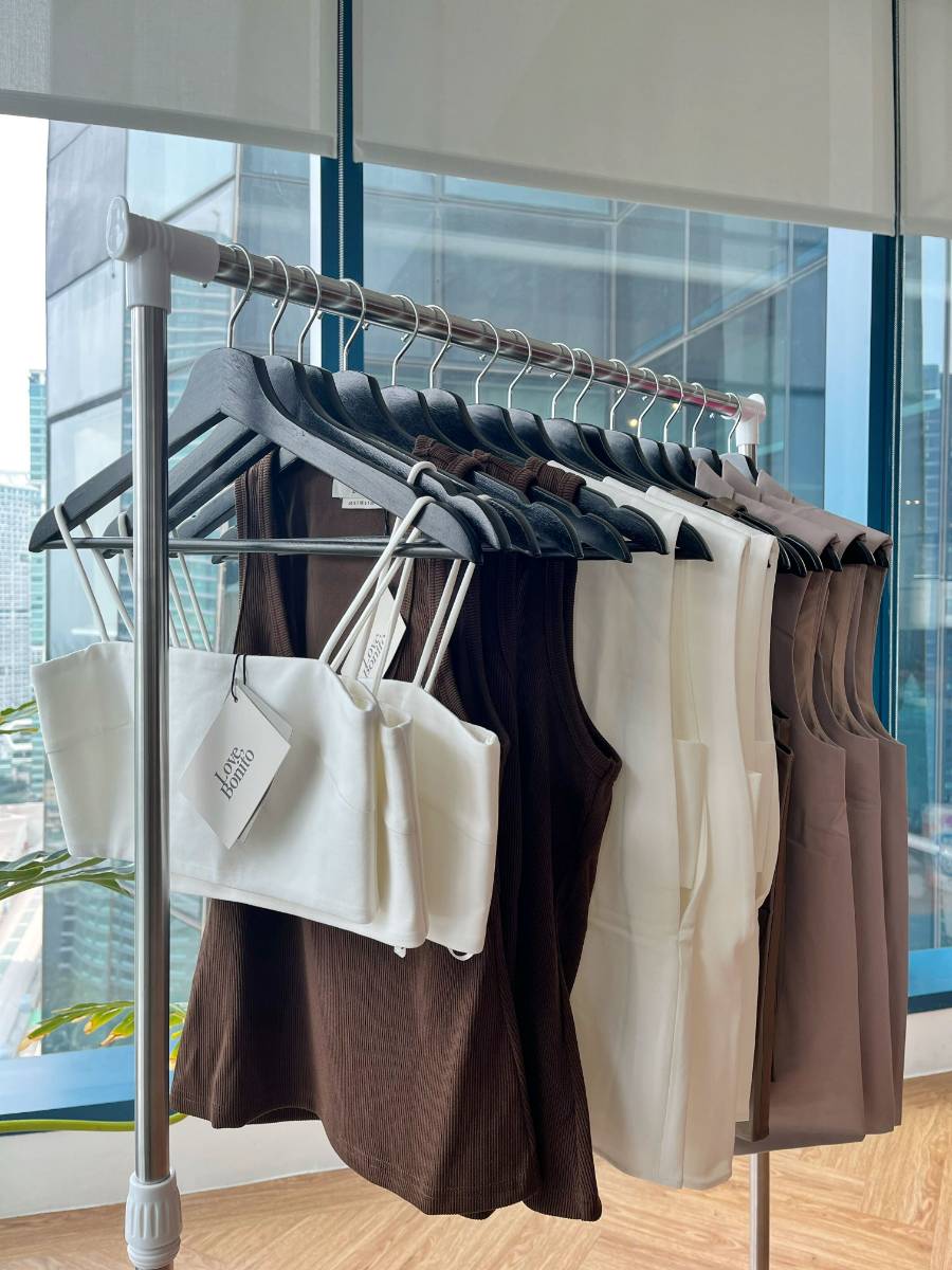A rack of items from The Hybrid Wardrobe Collection by Love, Bonito.