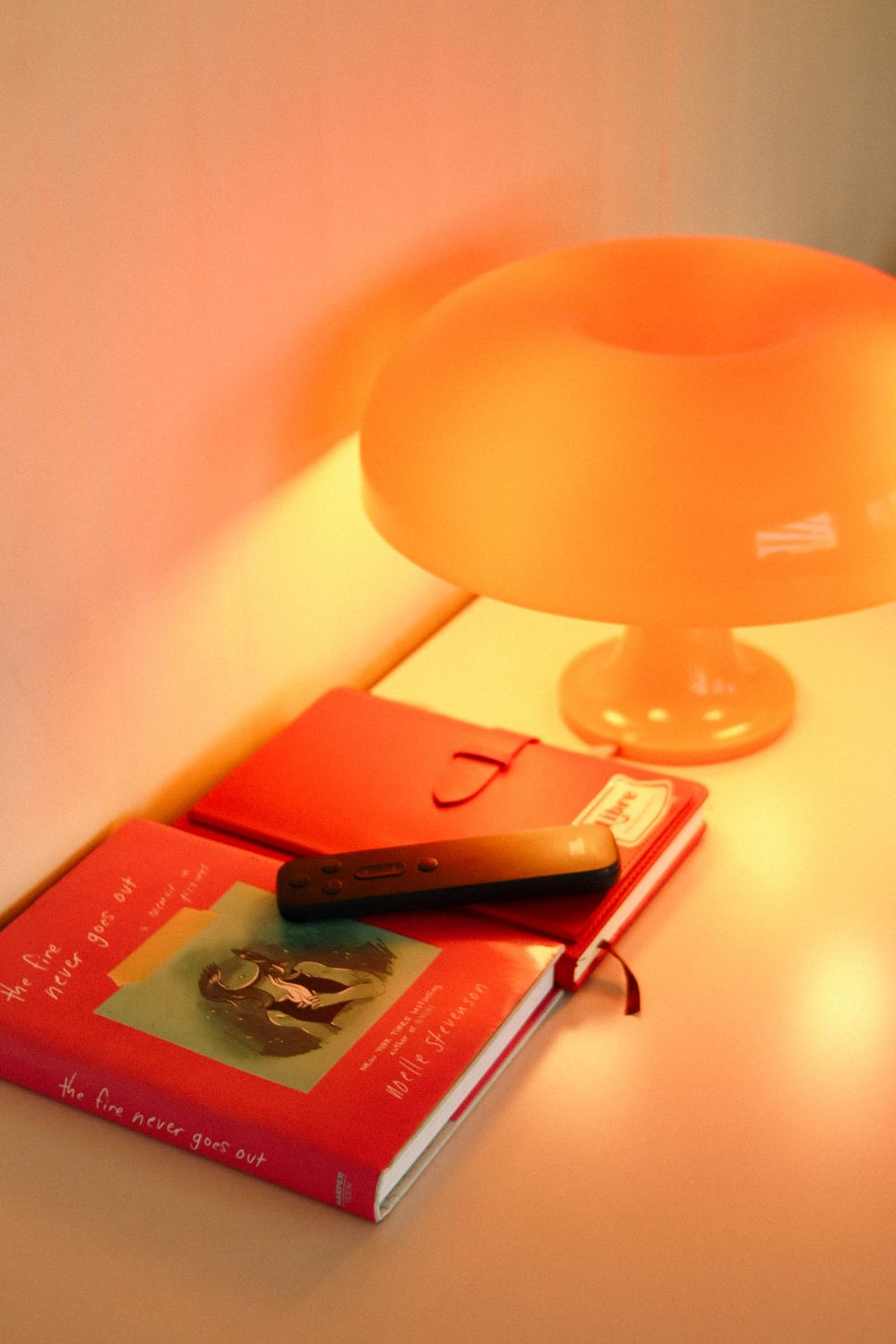 A book and lamp at Maria Clara Cafe