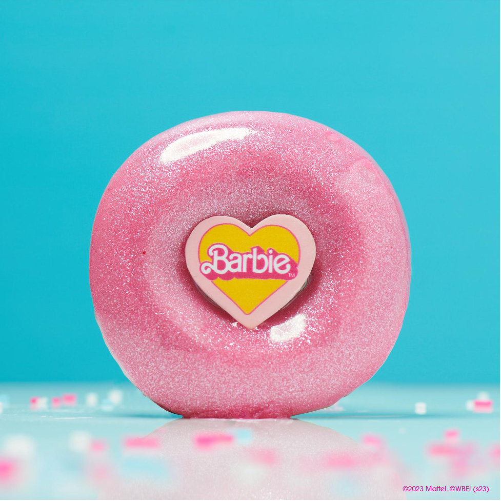 Barbie™ doughnut (P70) which is a pink, glittergelli glazed ring doughnut with a Barbie candy topper.
